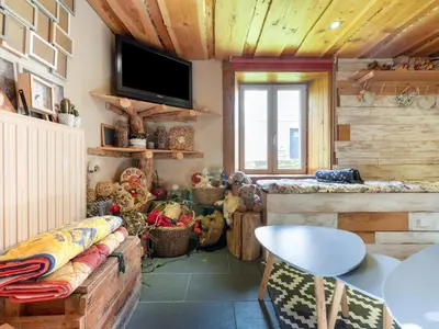 Télévision ou salle de divertissement dans l'établissement La Maison de Max - avec terrasse