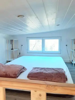 Un ou plusieurs lits dans un hébergement de l'établissement Tiny House JOY