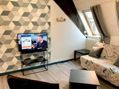 Télévision ou salle de divertissement dans l'établissement Cité des Princes