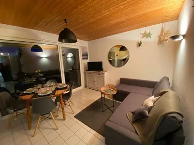 Coin salon dans l'établissement Gérardmer Appt 4/6 rez de jardin