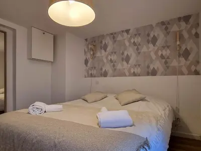 Un ou plusieurs lits dans un hébergement de l'établissement Travel Homes - NewGate 1, elegant, heart of Colmar