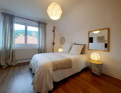 Un ou plusieurs lits dans un hébergement de l'établissement Rooms 6 persons Kaysersberg