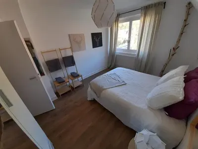 Un ou plusieurs lits dans un hébergement de l'établissement Rooms 6 persons Kaysersberg