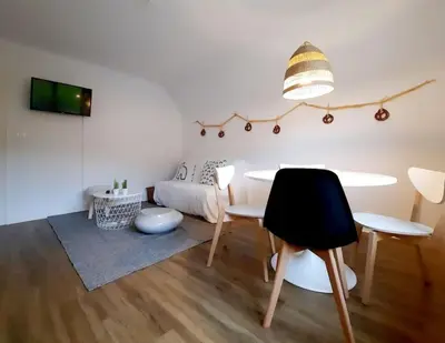 Coin salon dans l'établissement Rooms 6 persons Kaysersberg