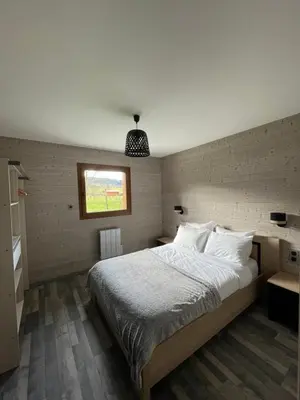 Un ou plusieurs lits dans un hébergement de l'établissement Le Chalet Du Castor