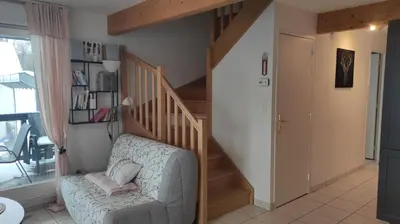 Coin salon dans l'établissement Duplex Estelle - 2 couples ou famille