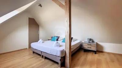 Un ou plusieurs lits dans un hébergement de l'établissement Villa Louisa