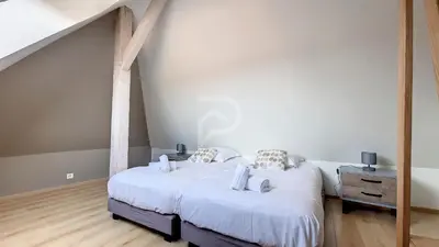 Un ou plusieurs lits dans un hébergement de l'établissement Villa Louisa