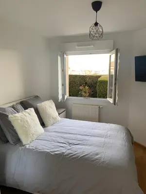 Un ou plusieurs lits dans un hébergement de l'établissement Appartement Premium Le Marquis