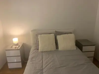 Un ou plusieurs lits dans un hébergement de l'établissement Appartement Premium Le Marquis