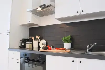 Cuisine ou kitchenette dans l'établissement L'échappée belle, proche gare centrale