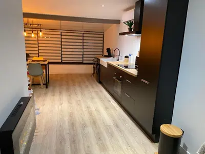 Cuisine ou kitchenette dans l'établissement L’appartement du Fayé avec jacuzzi privé
