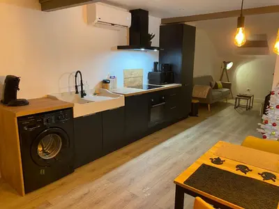 Cuisine ou kitchenette dans l'établissement L’appartement du Fayé avec jacuzzi privé