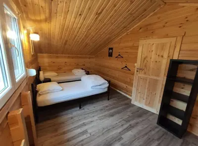 Un ou plusieurs lits dans un hébergement de l'établissement Chalet Cosy familial avec billard 6 pers près Gerardmer