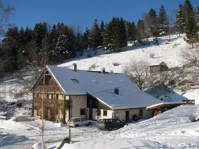 L'établissement Appartement dans vielle ferme au coeur des Vosges en hiver
