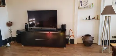 Télévision ou salle de divertissement dans l'établissement Au kouglof avec Netflix