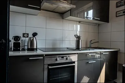Cuisine ou kitchenette dans l'établissement Au kouglof avec Netflix