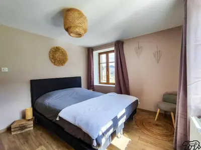 Un ou plusieurs lits dans un hébergement de l'établissement Gîte de la Ravanne