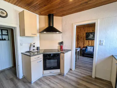 Cuisine ou kitchenette dans l'établissement Charmant appartement à Gérardmer