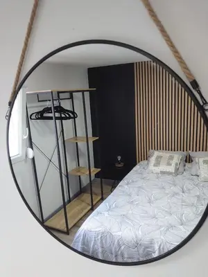 Un ou plusieurs lits dans un hébergement de l'établissement Charmant appartement à Gérardmer