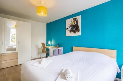 Un ou plusieurs lits dans un hébergement de l'établissement Le 17-GregIMMO-Appart'Hôtel