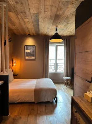 Un ou plusieurs lits dans un hébergement de l'établissement Studio façon chalet montagnard - Hyper centre