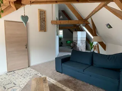 Coin salon dans l'établissement Nid de cigogne