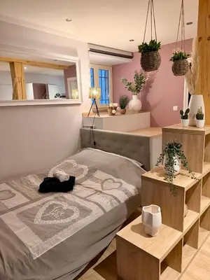 Un ou plusieurs lits dans un hébergement de l'établissement Studio cosy Kaysersberg centre