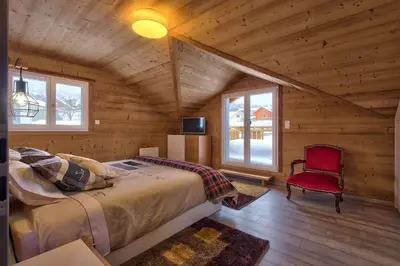 Un ou plusieurs lits dans un hébergement de l'établissement Chalet La Trinité-Spa,Sauna,Pétanque-Gérardmer