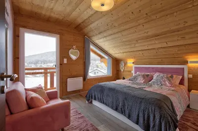 Un ou plusieurs lits dans un hébergement de l'établissement Chalet La Trinité-Spa,Sauna,Pétanque-Gérardmer