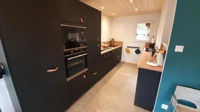 Cuisine ou kitchenette dans l'établissement CHALET LES PRIMEVÈRES 4 Étoiles
