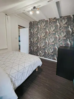 Un ou plusieurs lits dans un hébergement de l'établissement Appartement Le Baroque en duplex