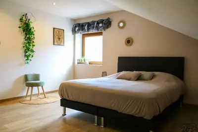 Un ou plusieurs lits dans un hébergement de l'établissement Gîte de la Ravanne