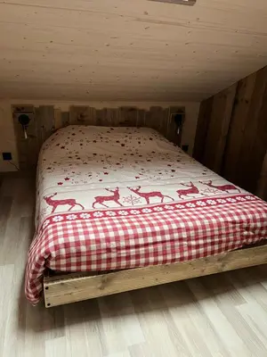 Un ou plusieurs lits dans un hébergement de l'établissement Chalet L'Ôbresse