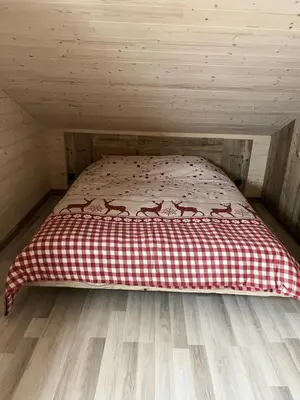 Un ou plusieurs lits dans un hébergement de l'établissement Chalet L'Ôbresse