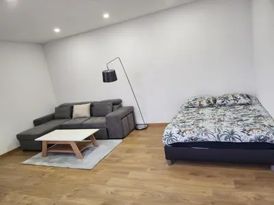 Un ou plusieurs lits dans un hébergement de l'établissement Joli Studio cosy